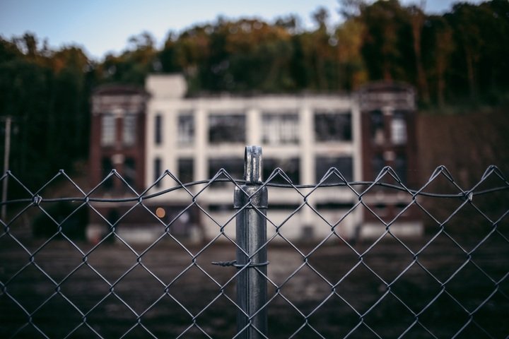 chain link fence with building in back